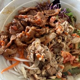 Korean bowl with: Salad & rice base  Spicy pork Chicken Bulgogi