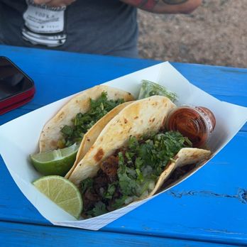 El Campechano Taco - a man holding a cell phone - Food Trucks Near Me - Leander, Texas
