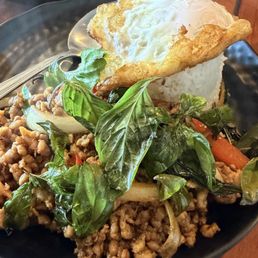 Krapow (Basil Chicken) topped with fried egg Krapow (Basil Chicken) topped with fried egg