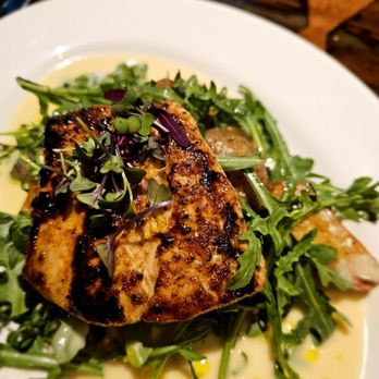 Trenasse - Mahi grilled fish with lemon beurre sauce over arugula - Wine Bars Near Me - New Orleans, Louisiana Trenasse - Mahi grilled fish with lemon beurre sauce over arugula - Wine Bars Near Me - New Orleans, Louisiana