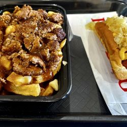 Burny Pit Stop - A delicious Beef Poutine with a Hotdog with toasted bread.