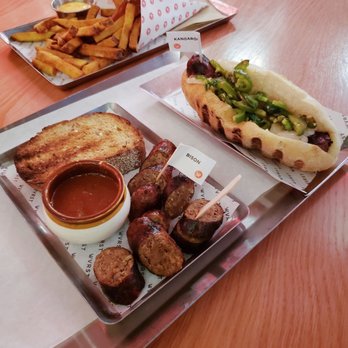 WVRST Union Station - Bison Currywvrst, Kangaroo sausage on a toasted bun, dirty duck fat fries - Beer Bar Near Me - Toronto, Ontario WVRST Union Station - Bison Currywvrst, Kangaroo sausage on a toasted bun, dirty duck fat fries - Beer Bar Near Me - Toronto, Ontario