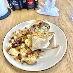 Oink Smokehouse - Brisket wrap a cheesy bacon fried potatoes. HOLY COW ! Delicious