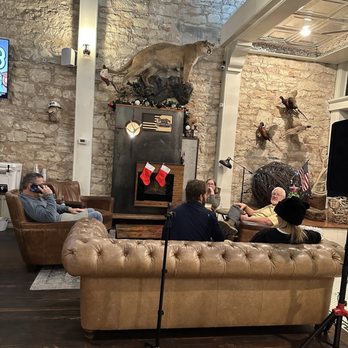 Mesquite Creek Outfitters - Couches and fireplace - Beer, Wine & Spirits Near Me - Georgetown, Texas