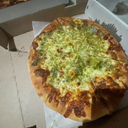 Plain white pizza with pesto. Plain white pizza with pesto.