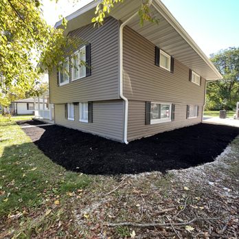 AG Irrigation - the front of a house with a mulch bed in front of it - Irrigation Near Me