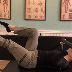 Dynamic Core - Using the Pilates Reformer's Infinity Footbar to do some supine pull-ups.
