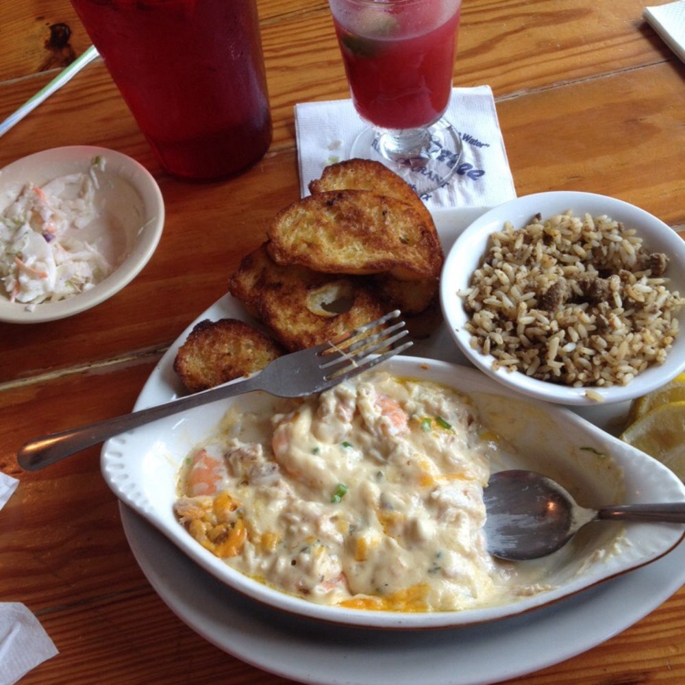 Stingaree - Shrimp & crabmeat au gratin, side of slaw, garlic toast & dirty rice with mixed berry stingarita - Seafood Near Me - Crystal Beach, Texas Stingaree - Shrimp & crabmeat au gratin, side of slaw, garlic toast & dirty rice with mixed berry stingarita - Seafood Near Me - Crystal Beach, Texas