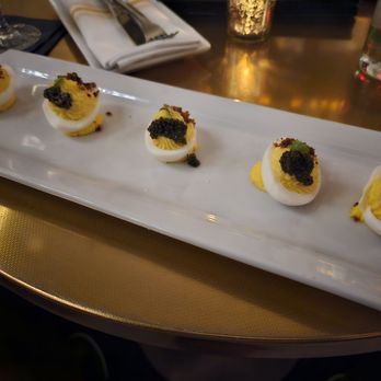 Bourbon N' Bubbles - Caviar deviled eggs: grained mustard, chicken cracklings, pink Himalayan sea salt, & caviar. - Bars Near Me - Charleston, South Carolina