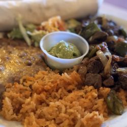 Alfredo's Restaurant - Beef tips, peppers, onions, rice and beans.