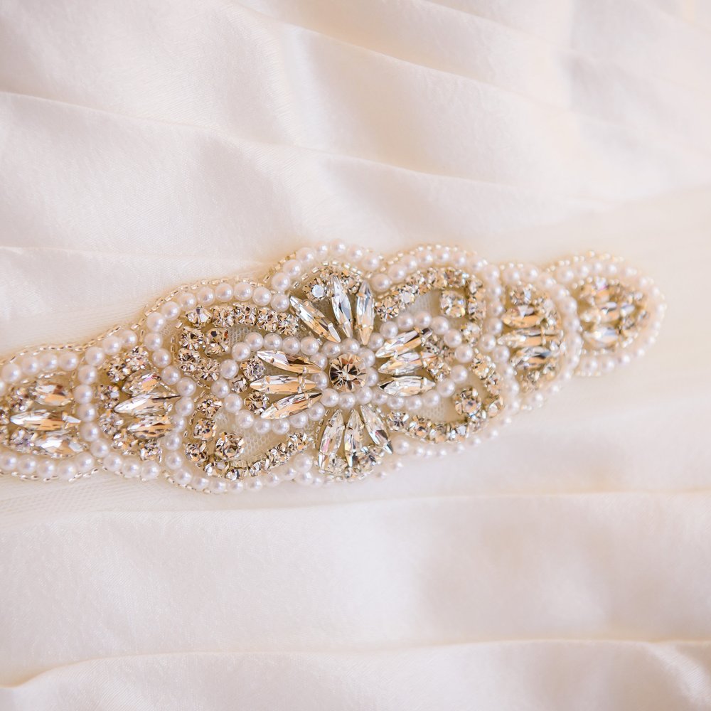 Mira Couture - Sash carefully sewn into my pleated silk jacquard wedding dress by Mira Couture.  Photo credit: Pawinski Photography. - Women's Clothing Near Me - Chicago, Illinois