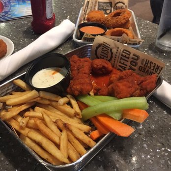 Main Event Louisville - Boneless wings in buffalo sauce with fries - Arcades Near Me - Louisville, Kentucky