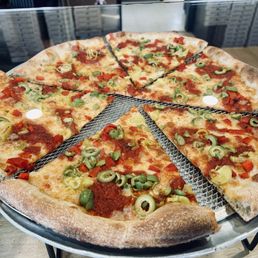 3/26/26 - a pizza with olives in the display case