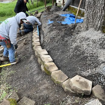 Ruiz Landscaping - two men working on a garden - Landscaping Near Me