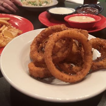 OurHouseKC - Onion rings with the Triple Wide appetizer sauces in the background - Gastropubs Near Me - Kansas City, Missouri