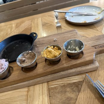 Magnolia Table - Biscuit with butter flight. Berry citrus butter, cinnamon butter, pumpkin butter and honey butter (which you cal tell was our favorite)! - Breakfast & Brunch Near Me - Waco, Texas