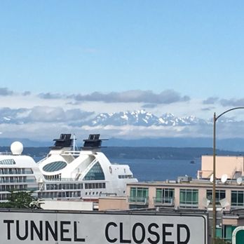 Seattle Free Walking Tours - Snow capped mountains in the distance in late May. - Walking Tours Near Me - Seattle, Washington Seattle Free Walking Tours - Snow capped mountains in the distance in late May. - Walking Tours Near Me - Seattle, Washington