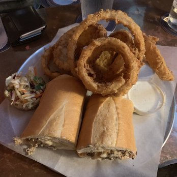 Copper Penny - Chestnut Chicken Sandwich with a side of Beer Battered Onion Rings - American Near Me - Wilmington, North Carolina Copper Penny - Chestnut Chicken Sandwich with a side of Beer Battered Onion Rings - American Near Me - Wilmington, North Carolina