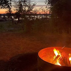Paradise Cove Campground - Evening fire and sunset looking over Lake Leelanau.
