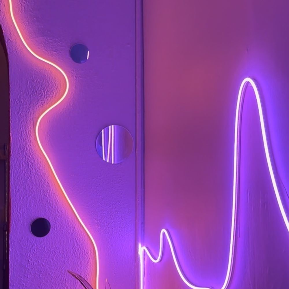 Karaoke Television - a neon neon sign in a room - Karaoke Near Me - Chico, California