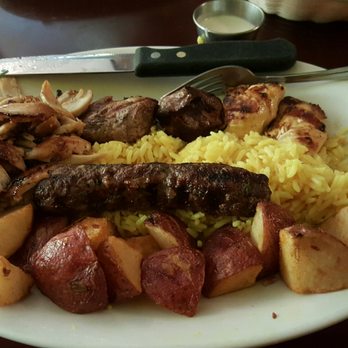 Nile Restaurant Hyde Park - Combination platter #14: beef shish kabab, shish taouk, chicken shawerma, kifta kabab with potatoes and rice. - Middle Eastern Near Me - Chicago, Illinois Nile Restaurant Hyde Park - Combination platter #14: beef shish kabab, shish taouk, chicken shawerma, kifta kabab with potatoes and rice. - Middle Eastern Near Me - Chicago, Illinois