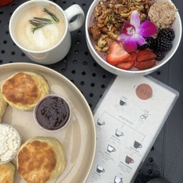 biscuits, latte, and a smoothie bowl. biscuits, latte, and a smoothie bowl.
