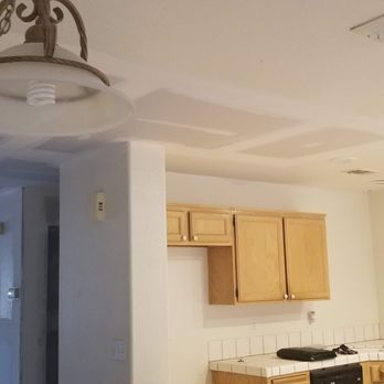 Eley Construction - a kitchen with a light fixture - Flooring Near Me - Mohave Valley, Arizona Eley Construction - a kitchen with a light fixture - Flooring Near Me - Mohave Valley, Arizona