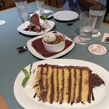 Peter B's - 9 layer cake, berry crumble, and the bomb (in the very back) - Breweries Near Me - Monterey, California