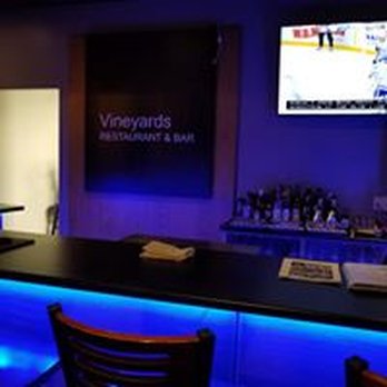 Vineyards Wine Bar - a bar with blue lighting - Wine Bars Near Me - Thunder Bay, Ontario Vineyards Wine Bar - a bar with blue lighting - Wine Bars Near Me - Thunder Bay, Ontario
