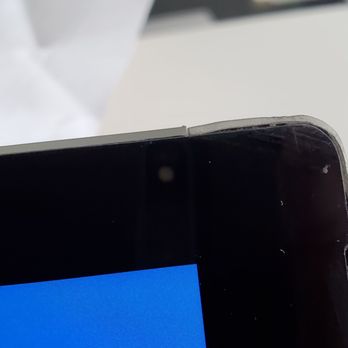 SquareTrade - You can see the front right hand side of the tablet. The frame is slightly bent and you can see the missing speaker grille. - Mobile Phone Repair Near Me - Brisbane, California SquareTrade - You can see the front right hand side of the tablet. The frame is slightly bent and you can see the missing speaker grille. - Mobile Phone Repair Near Me - Brisbane, California