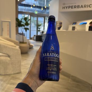 Next Health - Bottled water in glass - IV Hydration Near Me - Bellevue, Washington