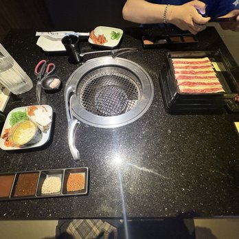 Honō Japanese BBQ - Set up , stacked meat WITH instructions on how long to cook the meat . - Japanese Near Me - Dallas, Texas