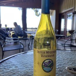 a bottle of wine on a table a bottle of wine on a table
