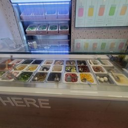 a display of a variety of salads a display of a variety of salads
