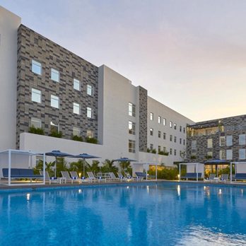 City Express Plus - Hotel from pool view - Hotels Near Me - Cancún, ROO
