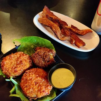Maxine's On Shine - Fried green tomatoes, crab cake and a side of bacon. - New American Near Me - Orlando, Florida Maxine's On Shine - Fried green tomatoes, crab cake and a side of bacon. - New American Near Me - Orlando, Florida