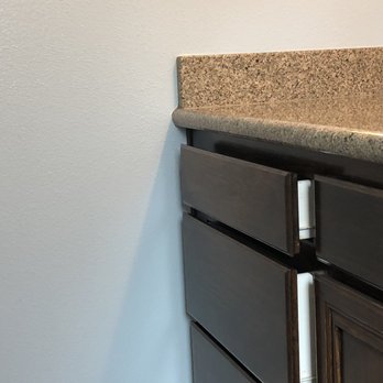 All N 1 Painting - Fresh, beautiful blue wall paint and white trim with contrasting darker stained cabinets. - Painters Near Me All N 1 Painting - Fresh, beautiful blue wall paint and white trim with contrasting darker stained cabinets. - Painters Near Me