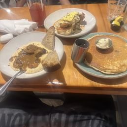 L-R: Shrimp & Grits, Couyon Daddy (chicken biscuit, Blueberry Pancakes and the sweet peach iced tea.