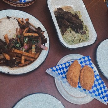 Casa Chaskis - Fresh bread, Beef empanadas, lomo saltado con bistec, and tallarín verde con bistec - Peruvian Near Me - Long Beach, California
