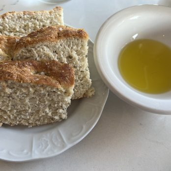 Lupo Italian Kitchen - Bread and olive. I recommend asking for Parmesan cheese and red pepper flakes to add to the olive oil-- chef's kiss! - Italian Near Me - Rehoboth Beach, Delaware Lupo Italian Kitchen - Bread and olive. I recommend asking for Parmesan cheese and red pepper flakes to add to the olive oil-- chef's kiss! - Italian Near Me - Rehoboth Beach, Delaware
