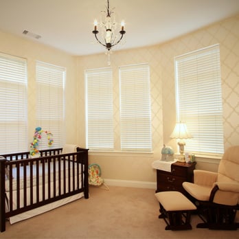 Blue Door Painters - a baby's room with a crib and rocking chair - Painters Near Me - Arlington, Virginia Blue Door Painters - a baby's room with a crib and rocking chair - Painters Near Me - Arlington, Virginia