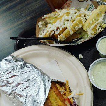 Cilantro & Ajo - Chicken Patacon on the left, yucca fries in the middle right& brown lemonade farthest. All with the green Ajo sauce - Venezuelan Near Me - Pittsburgh, Pennsylvania