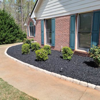 Mocal Remodeling - a front yard with black mulch - Flooring Near Me Mocal Remodeling - a front yard with black mulch - Flooring Near Me