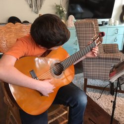 Wright Guitarist - Student Focusing in Lesson