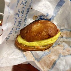 Auntie Anne's - Sausage, egg and cheese on a pretzel roll breakfast sandwich.
