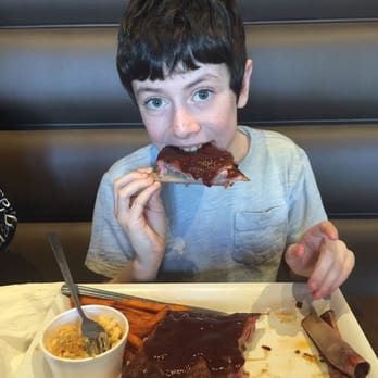 Beach Pit BBQ - Loving his ribs! Great place for kids and adults. - Barbeque Near Me - Costa Mesa, California
