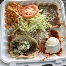 Carne asada taco, cheese enchilada , rice and refried beans.