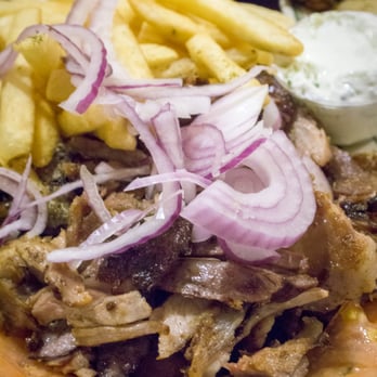 Messini Authentic Gyros - Grilled lamb gyros shaved from the spit and served with tzatziki and onions. - Greek Near Me - Toronto, Ontario Messini Authentic Gyros - Grilled lamb gyros shaved from the spit and served with tzatziki and onions. - Greek Near Me - Toronto, Ontario