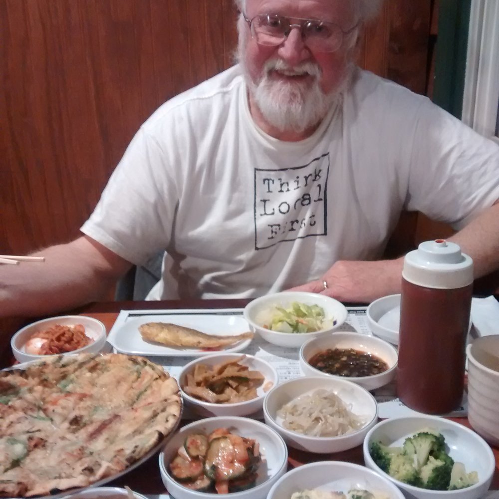 Tofu Kitchen - World-class Calligrapher Peter Thornton enjoying Seafood pancake (left corner) and their complimentary side dishes "banchan" - Korean Near Me - Johns Creek, Georgia Tofu Kitchen - World-class Calligrapher Peter Thornton enjoying Seafood pancake (left corner) and their complimentary side dishes "banchan" - Korean Near Me - Johns Creek, Georgia