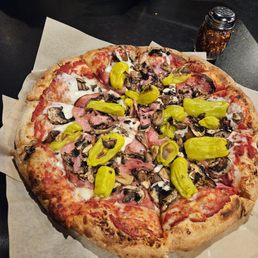 Salami mushroom and pepperchinni thick crust pizza. Salami mushroom and pepperchinni thick crust pizza.